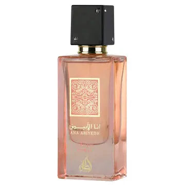 Lattafa Ana Abiyedh Coral EDP bottle with pink juice & gold accents