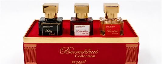 Three perfume bottles in a decorative red and gold box with 'Barakahat Collection' branding.