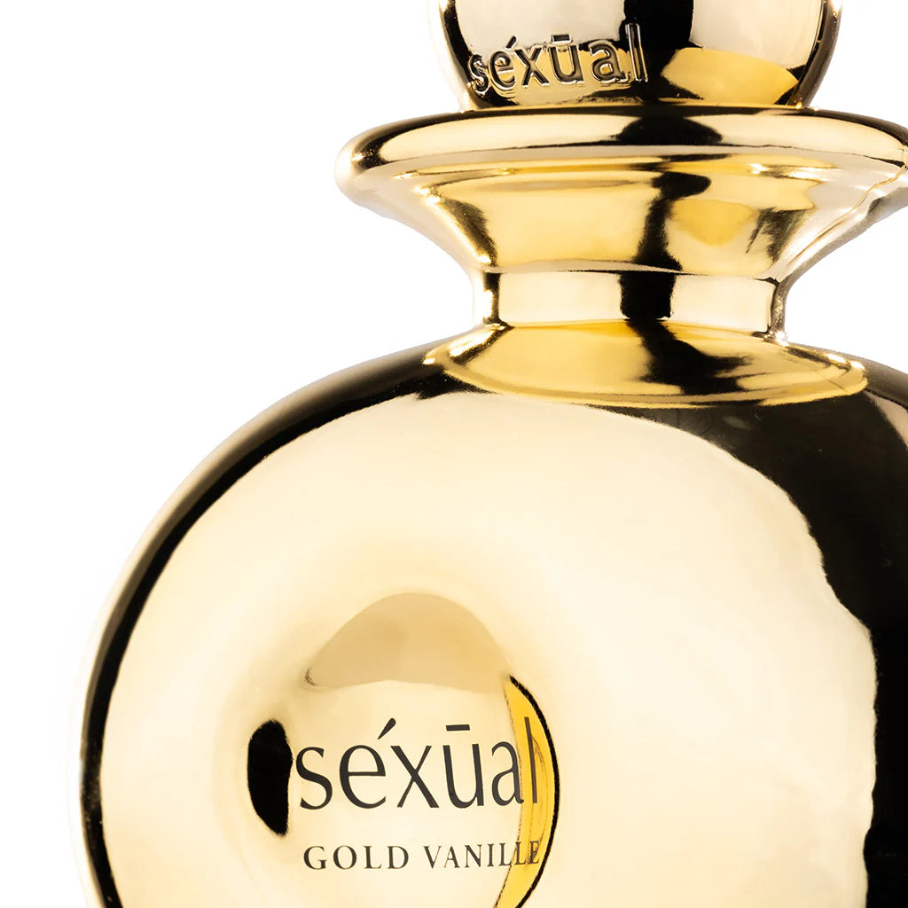 Gold perfume bottle labeled 'sexéual Gold Vanille' on a white background