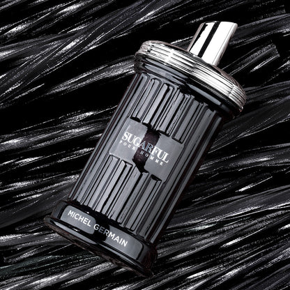 Sugarful Pour Homme men’s cologne bottle on black licorice background